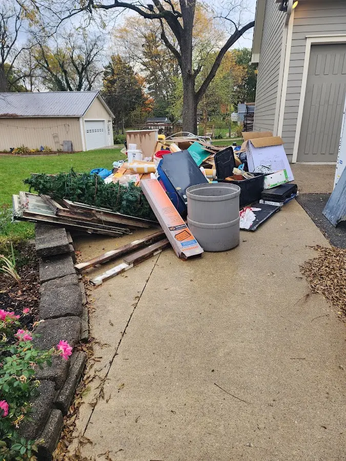 Dumpster being loaded with debris for Demolition Dumpster Rental in Walhalla